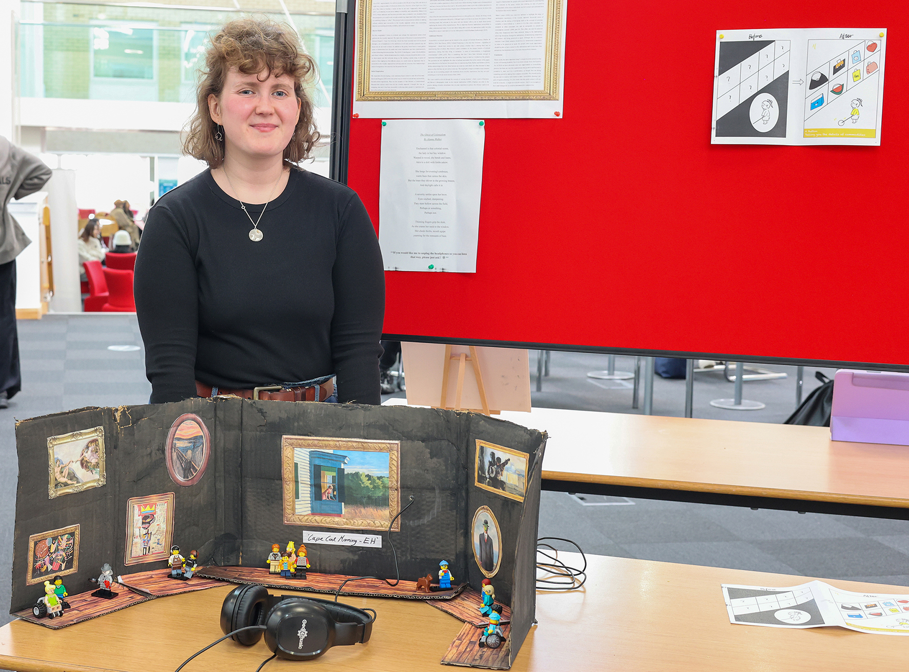 Student Alanna Walker with her artwork, a 3D model showing how poetry can be used as innovative and accessible audio descriptions for visually impaired consumers