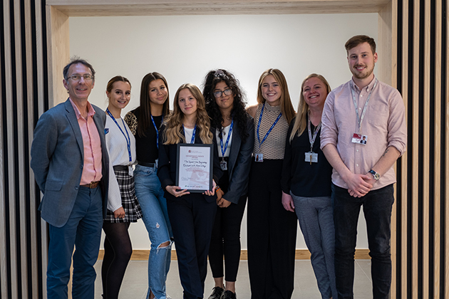 Blackpool Sixth Form college students pictured with their teacher, and LUMS' Professor Magnus George (left)