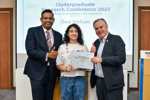 Sarah Yarham recieves award from Professor Simon Guy and Professor Abhi Veerakumarasivam