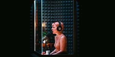 A woman in a sound booth