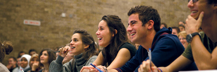 Students smiling in lecture theatre