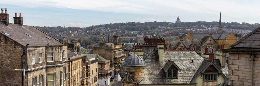 Lancaster landscape from Castle Hill looking down church Street showing showing roof tops and the Ashton memorial on the skyline