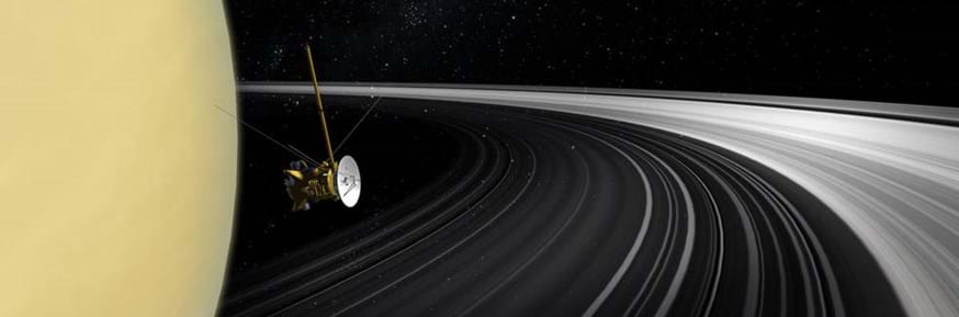 An artist's concept of the Cassini orbiter crossing Saturn's ring plane. Credits: NASA/JPL-Caltech