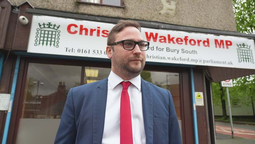 Photo of Christian Wakeford outside his constituency office in Bury South