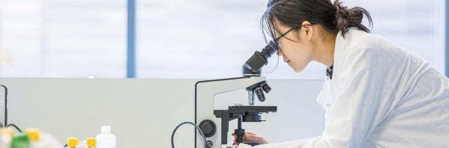 Image of student using a microscope
