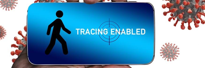 A hand holding a mobile phone with 'tracing enabled' displayed on the screen