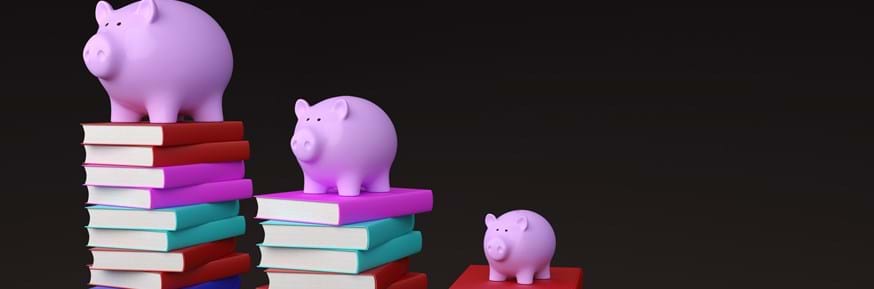 Piggy banks on piles of books