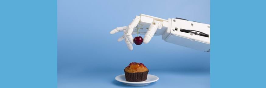 A robotic hand and a cupcake