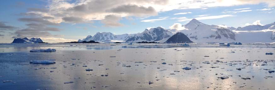 The mountainous and icy coastline of the Antarctic Peninsula