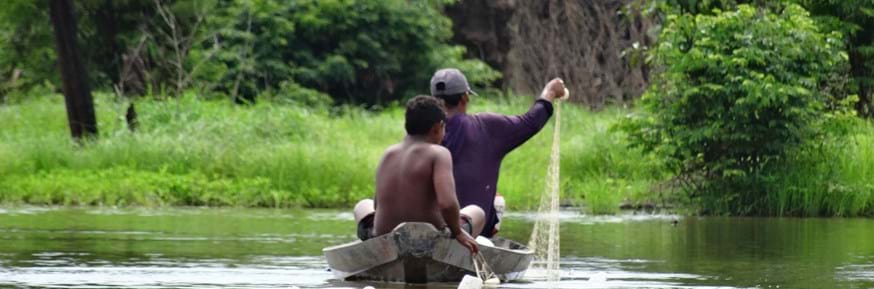 Amazonian fishermen in a canoe