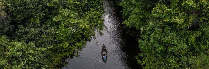 A canoe on a fresh water river in the Amazon