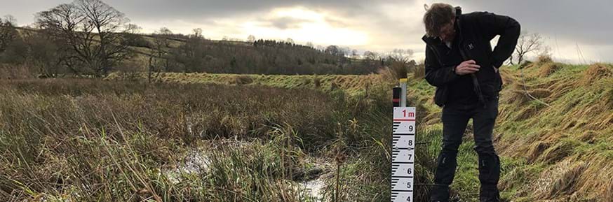 Nick Chappel installing hydrological monitoring equipment on the floodplain of the River Lowther in order to monitor the impacts of recent Natural Flood Management interventions.