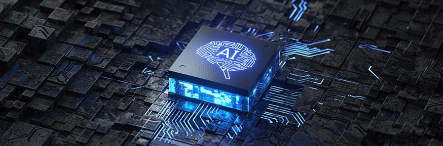 A computer microchip with AI and a picture of a brain printed on top.