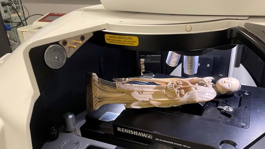 An ivory object, assumed to be of Asian elephant origin, under the microscope inside a Renishaw in Via Raman microspectrometer