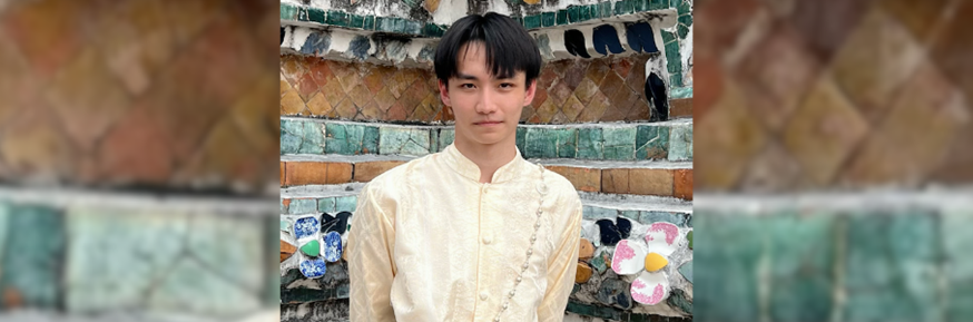 Jay Lin photographed in front of a decorative tiled wall