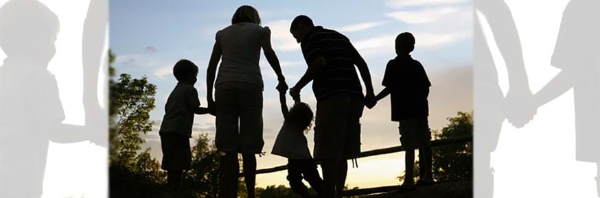 Silhouette of family on country walk
