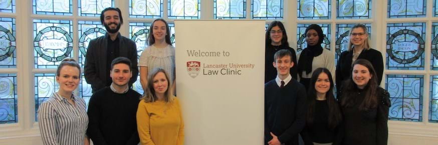 The Lancaster University Law Clinic team (pictured before the pandemic) with clinic staff including (bottom row) Sadie Whittam (left), Jordan Lynch (second from left) and Kathryn Saban (third from left)