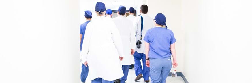 Medical staff walking down a corridor