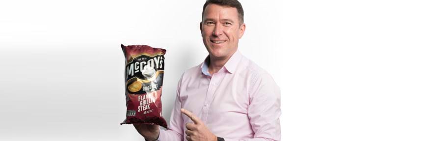 Mark Thorpe, KP Snacks, CEO poses with packet of McCoys Crisps