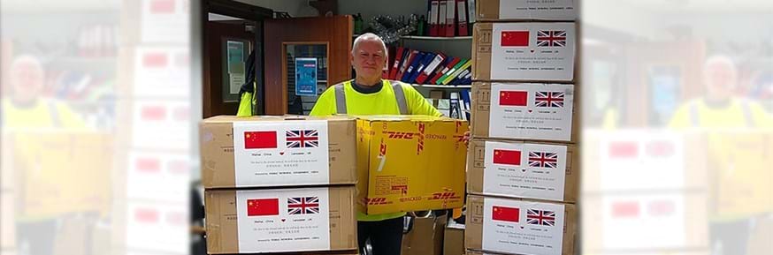Chris Taylor, a City Council HGV driver from the Waste and Refuse Department,unloads the boxes of masks