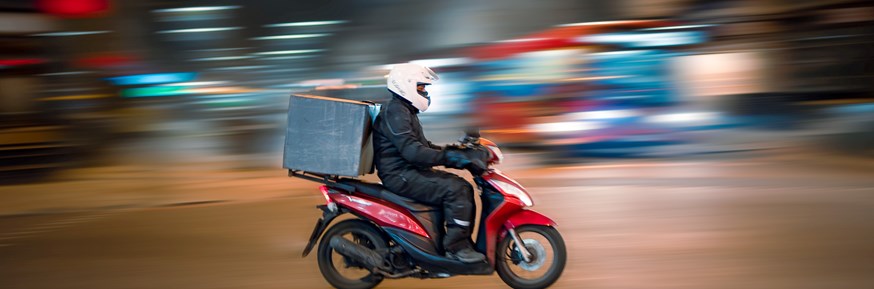 Motorcyclist with delivery box