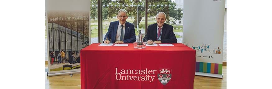 Lancaster Vice-Chancellor Professor Andy Schofield, and UHMBT Chair Professor Mike Thomas signing the Memorandum of Understanding