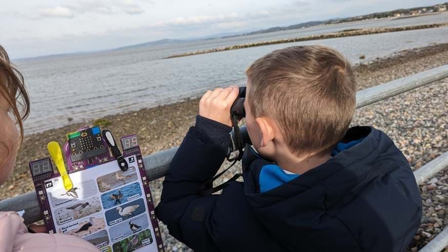 Pupils using clip:bits while collecting environmental data in Morecambe Bay