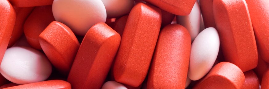 Pile of red and white pills