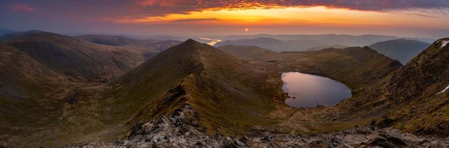Coleridge’s view from Helvellyn’s summit - shows rugged mountains, a sharp ridge and a lake.