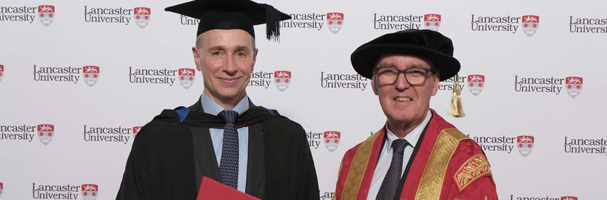 Thomas Buberl with the Chancellor of Lancaster University, the Rt Hon Alan Milburn.