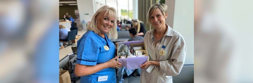 Catherine Randall, the NHS England Associate Director for National Safeguarding, with Claire Mason (right), from Lancaster University, with one of the 150 boxes packed on Wednesday