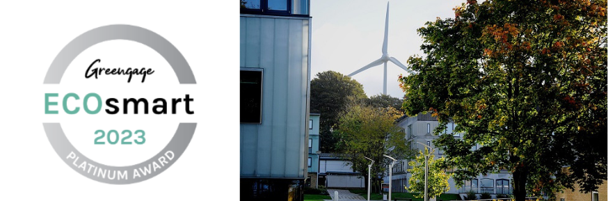 Greengage EcoSmart 2023 Platinum Award logo and image of LICA building and wind turbine in the background